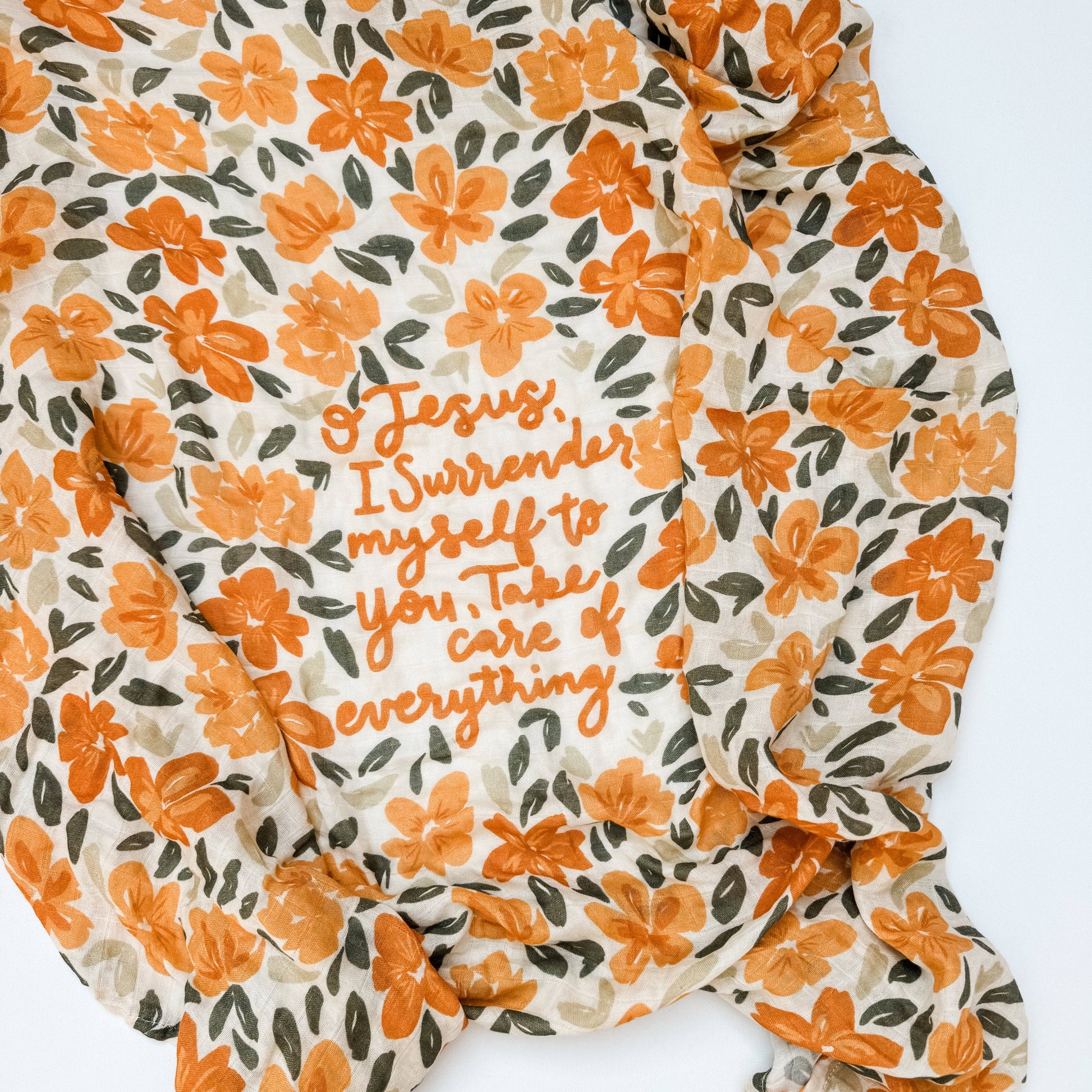 Floral fabric with orange text on a white background