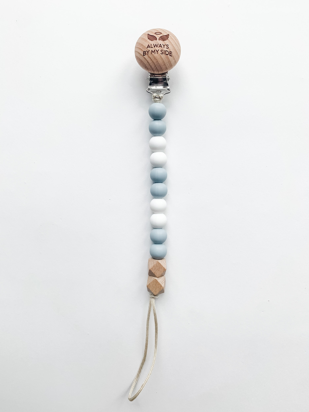 Wooden pacifier clip with gradient beads on a white background