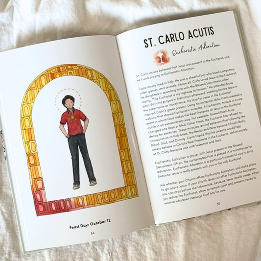 Open book with illustration of a person in a red shirt and dark pants, and text about St. Carlo Acutis.
