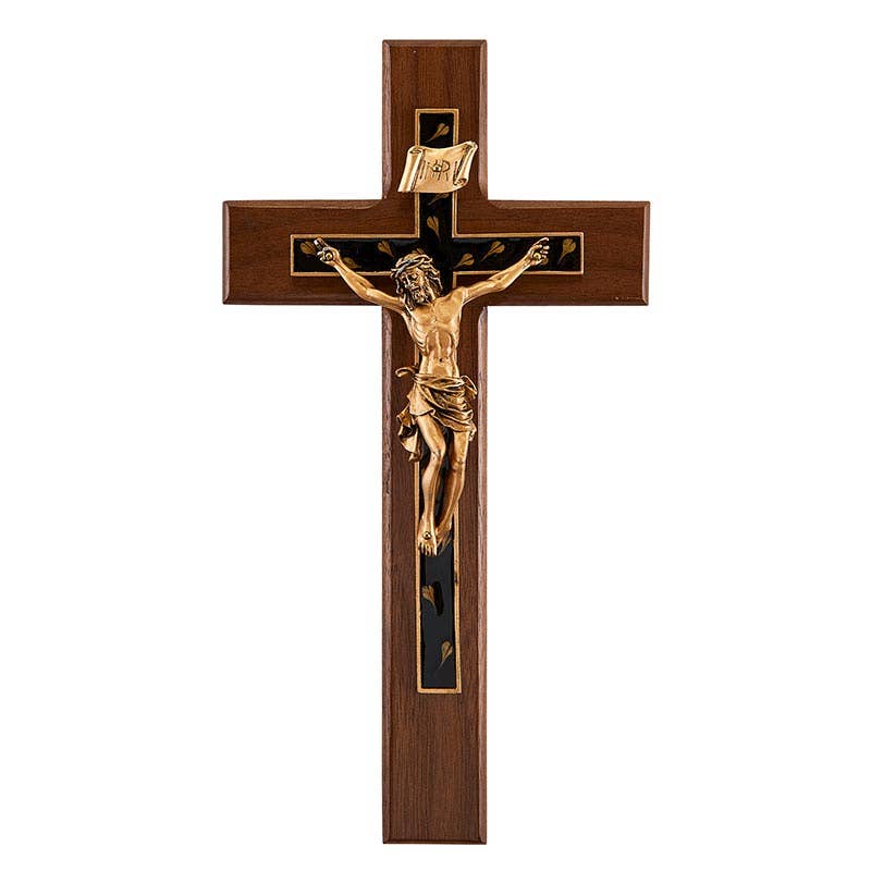 Wooden cross with gold Jesus figure on a white background