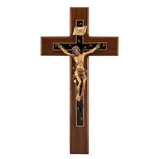 Wooden cross with gold Jesus figure on a white background