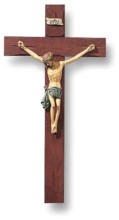 Wooden crucifix with a figure on a white background