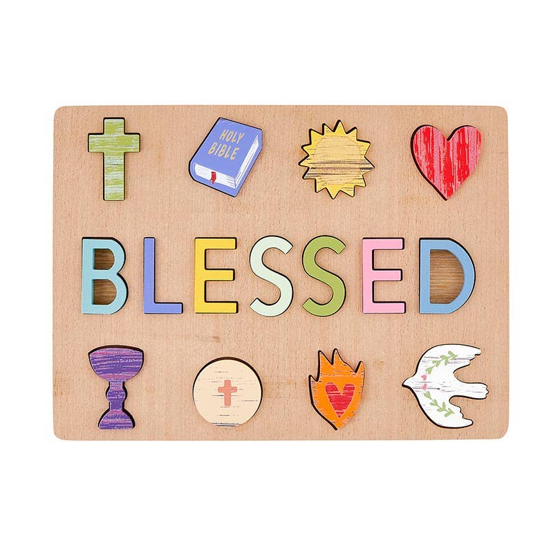 Wooden board with colorful letters spelling 'BLESSED' and religious symbols on a white background