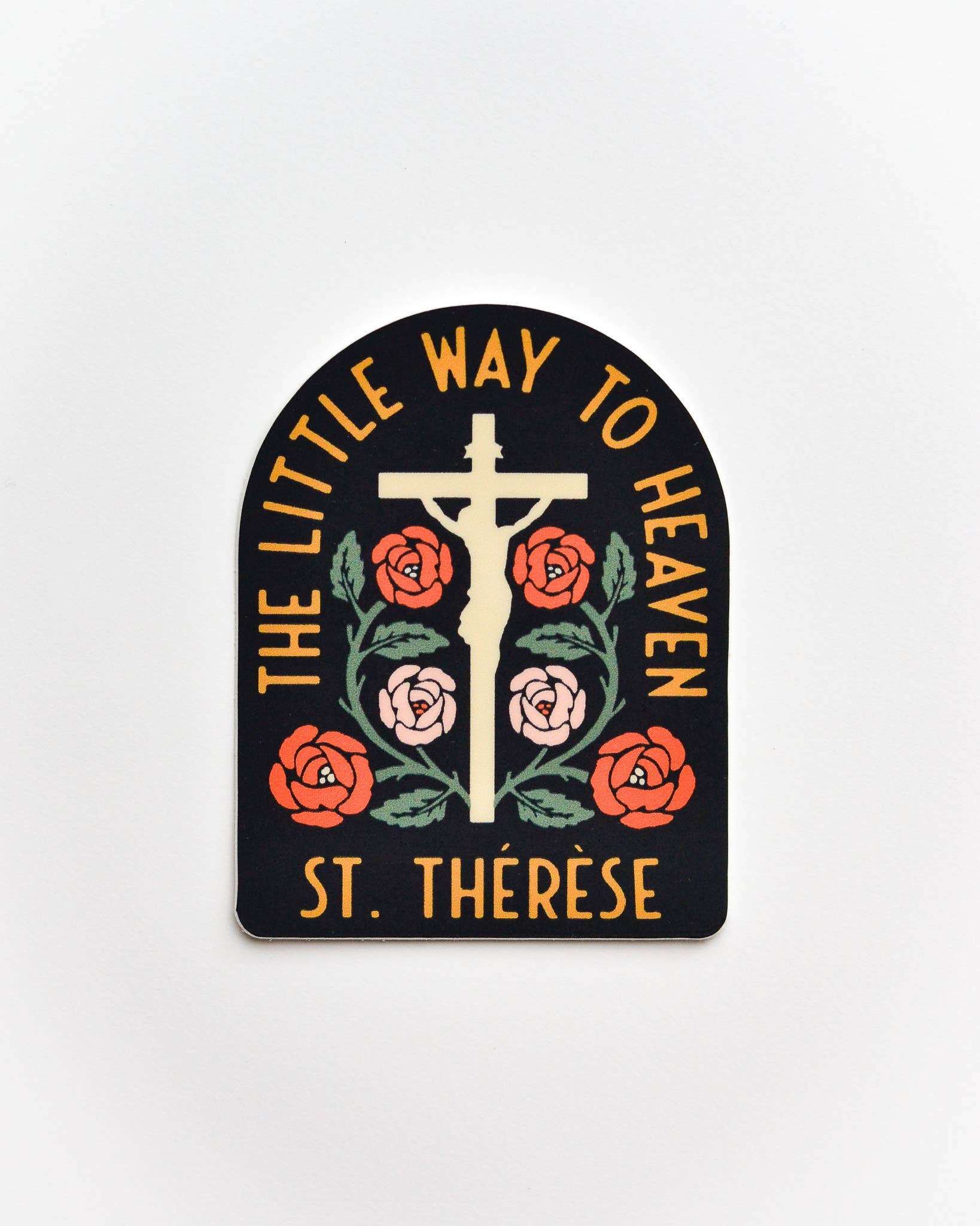 Decorative plaque with cross, roses, and text 'The Little Way to Heaven St. Therese' on a white background