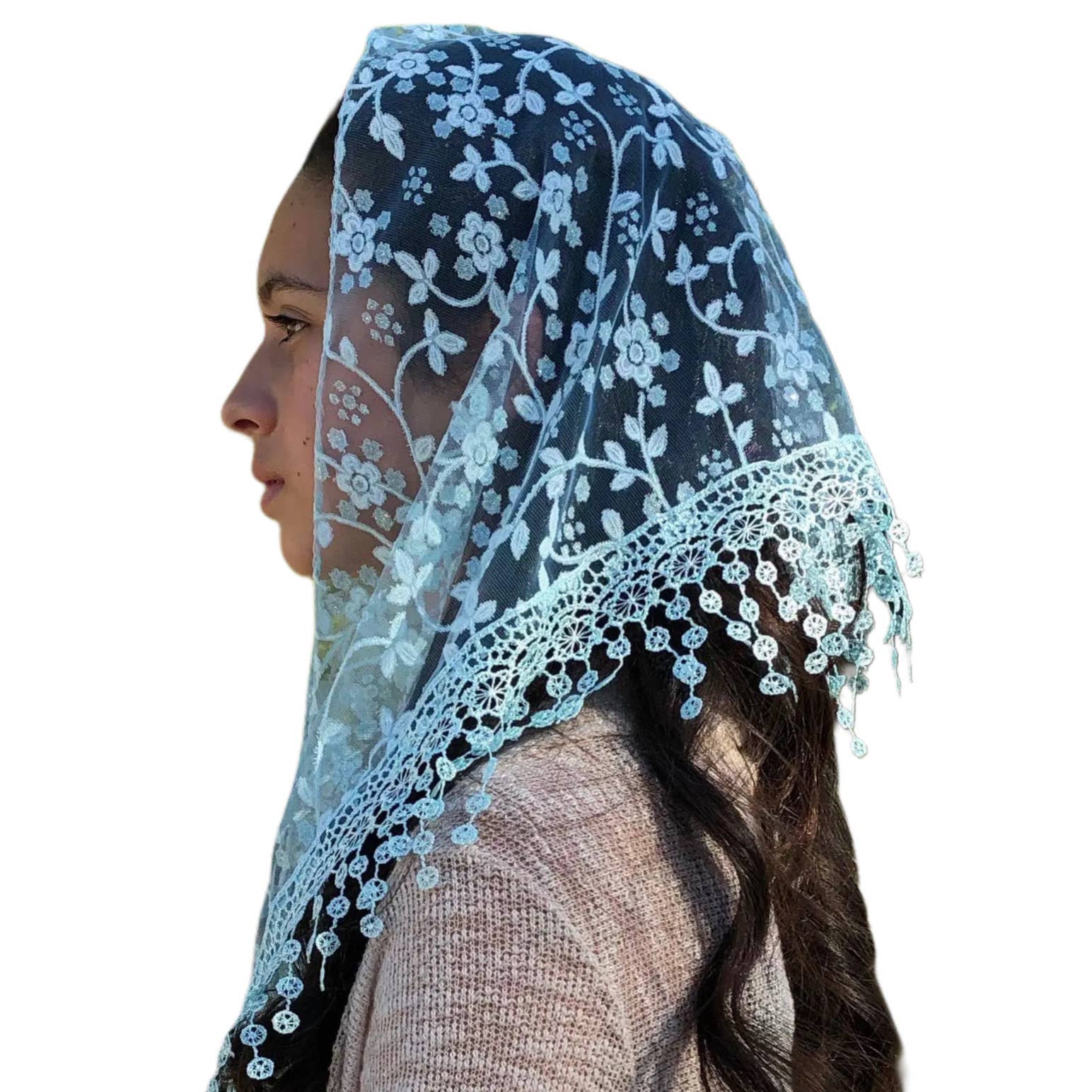 Woman wearing a blue lace veil on a white background