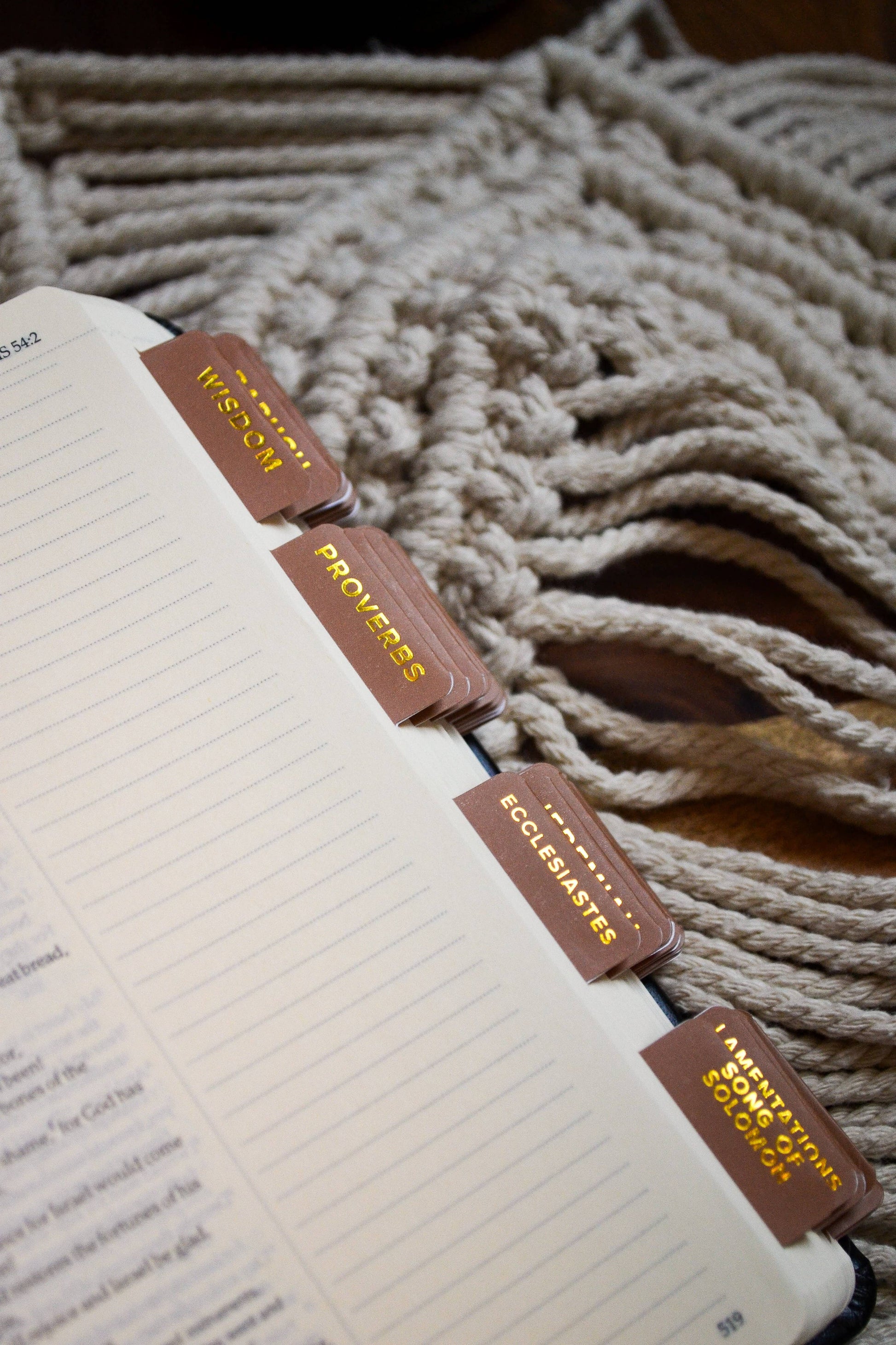 Notebook with custom planner stickers on a textured surface