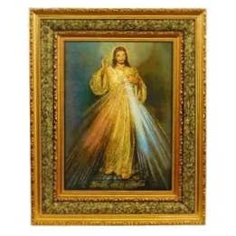 Framed artwork of Jesus in a gold robe with a bright light source.