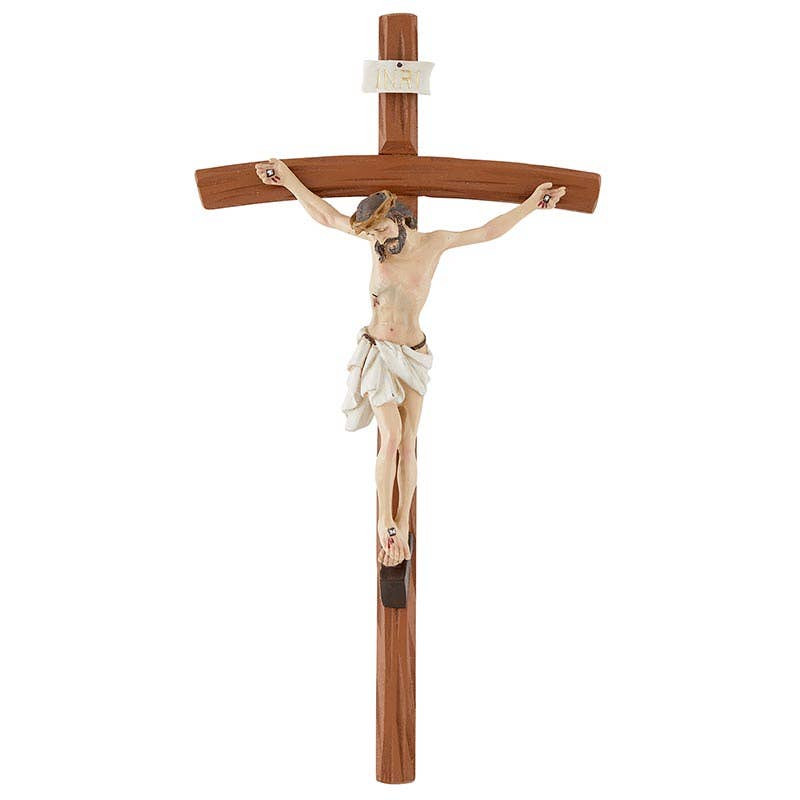 Wooden crucifix with a figure on a white background