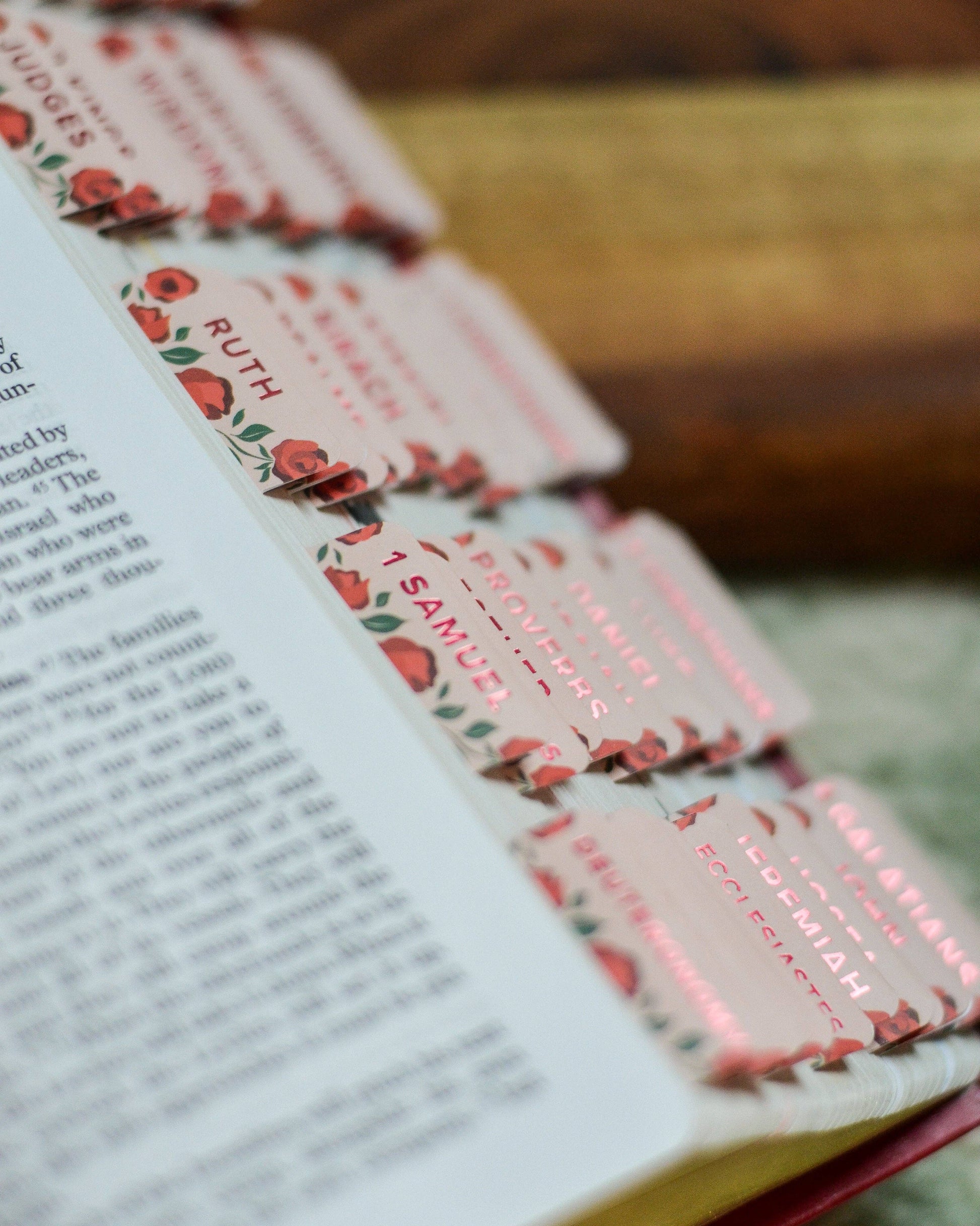 Decorative bookmarks with floral designs on a book