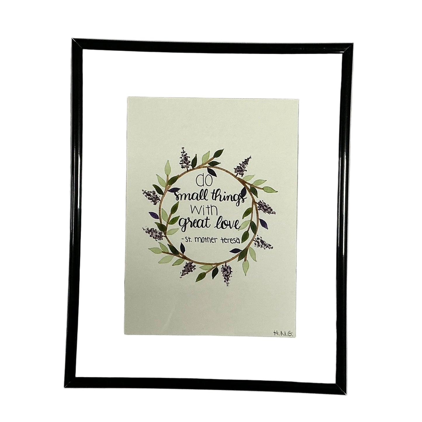 Framed artwork with decorative text and floral design on a light background