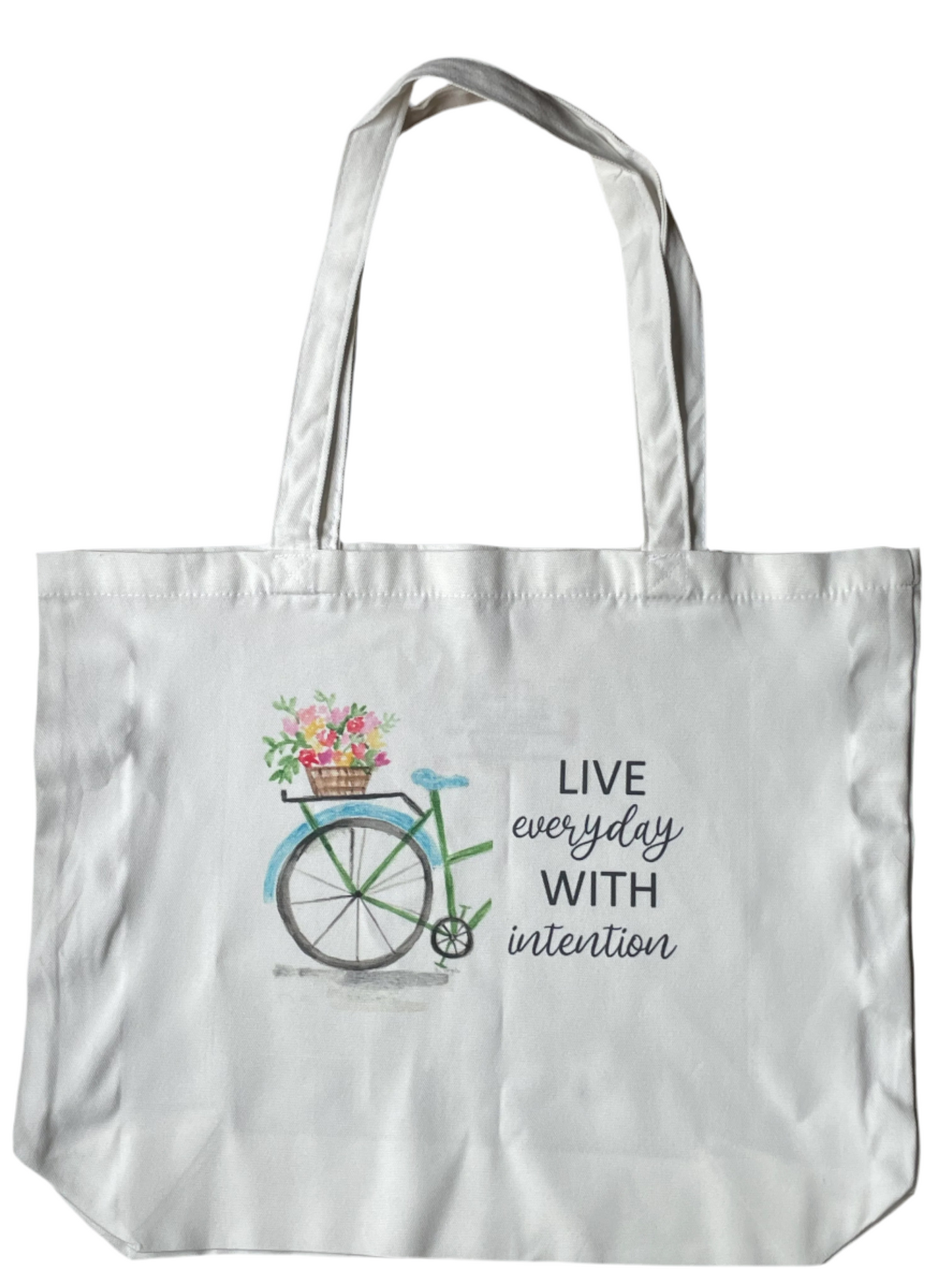 White tote bag with bicycle and flower design, featuring the text 'Live every day with intention'.