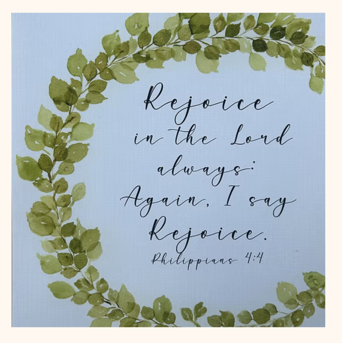 Product listings for wreaths with text on a smartphone screen