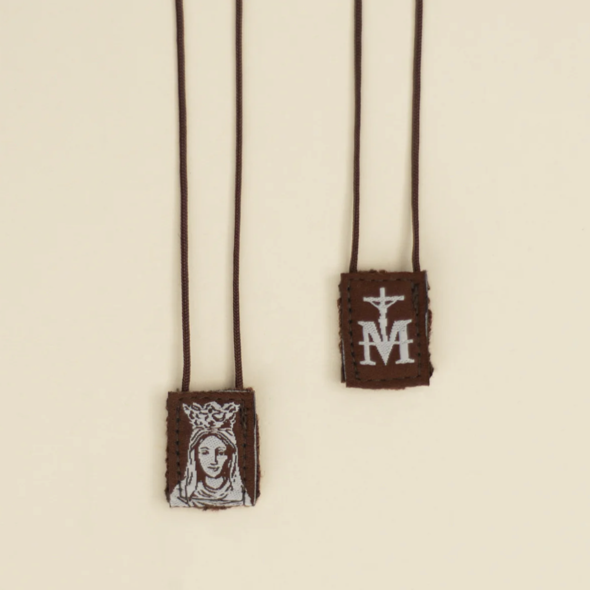 Our Lady of Mount Carmel scapular on a beige background