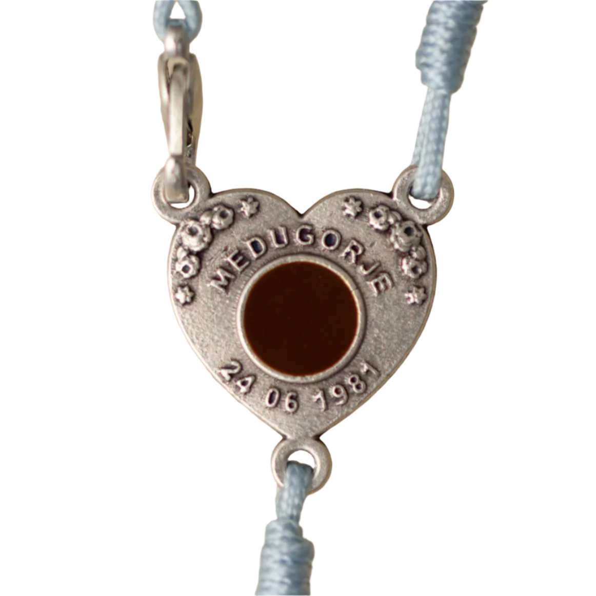 Heart-shaped pendant with engraved text on a white background
