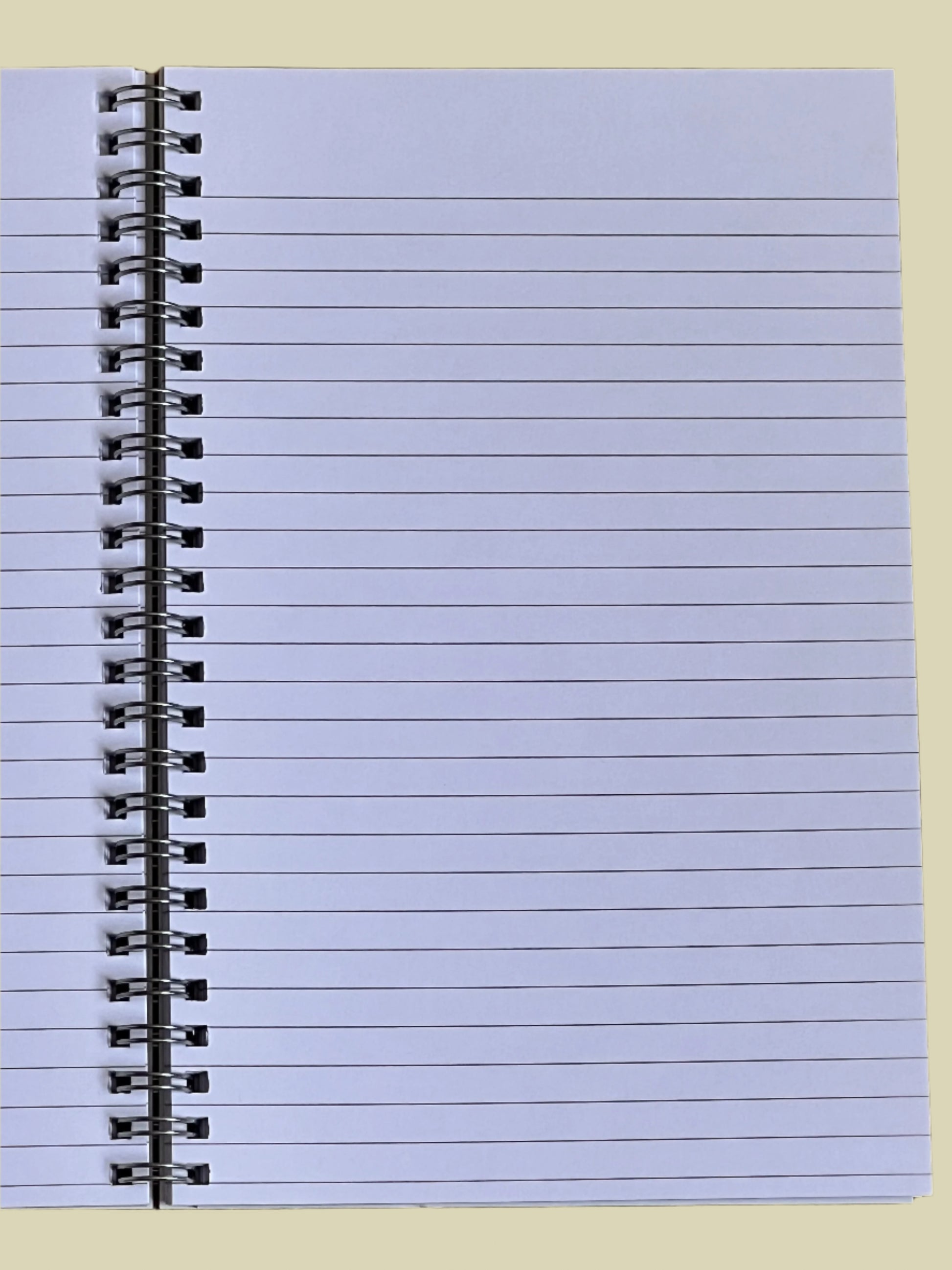 Notebook with spiral binding on a light purple cover