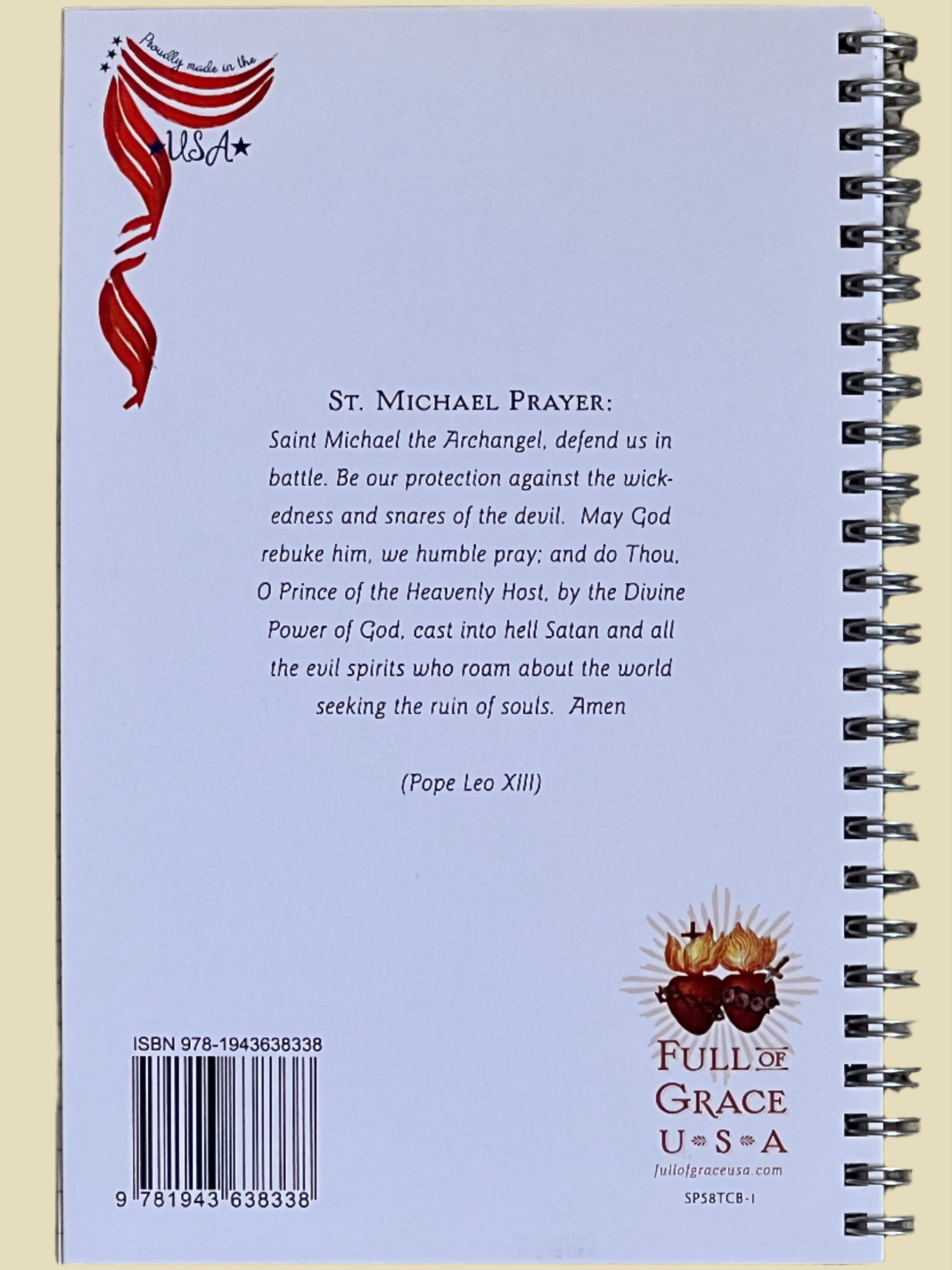 Back cover of a notebook with prayer text and branding