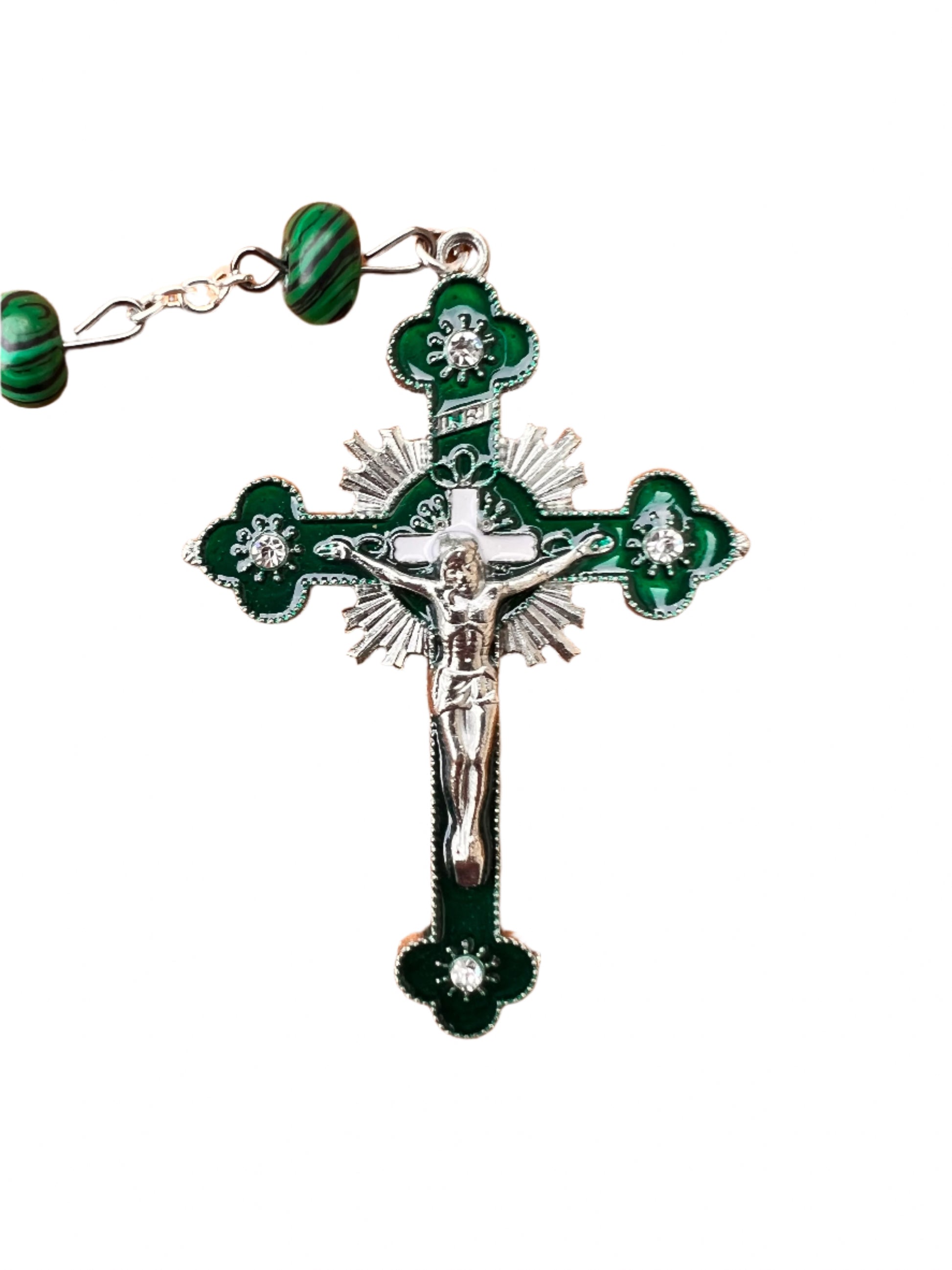 Green rosary with silver crucifix on a white background