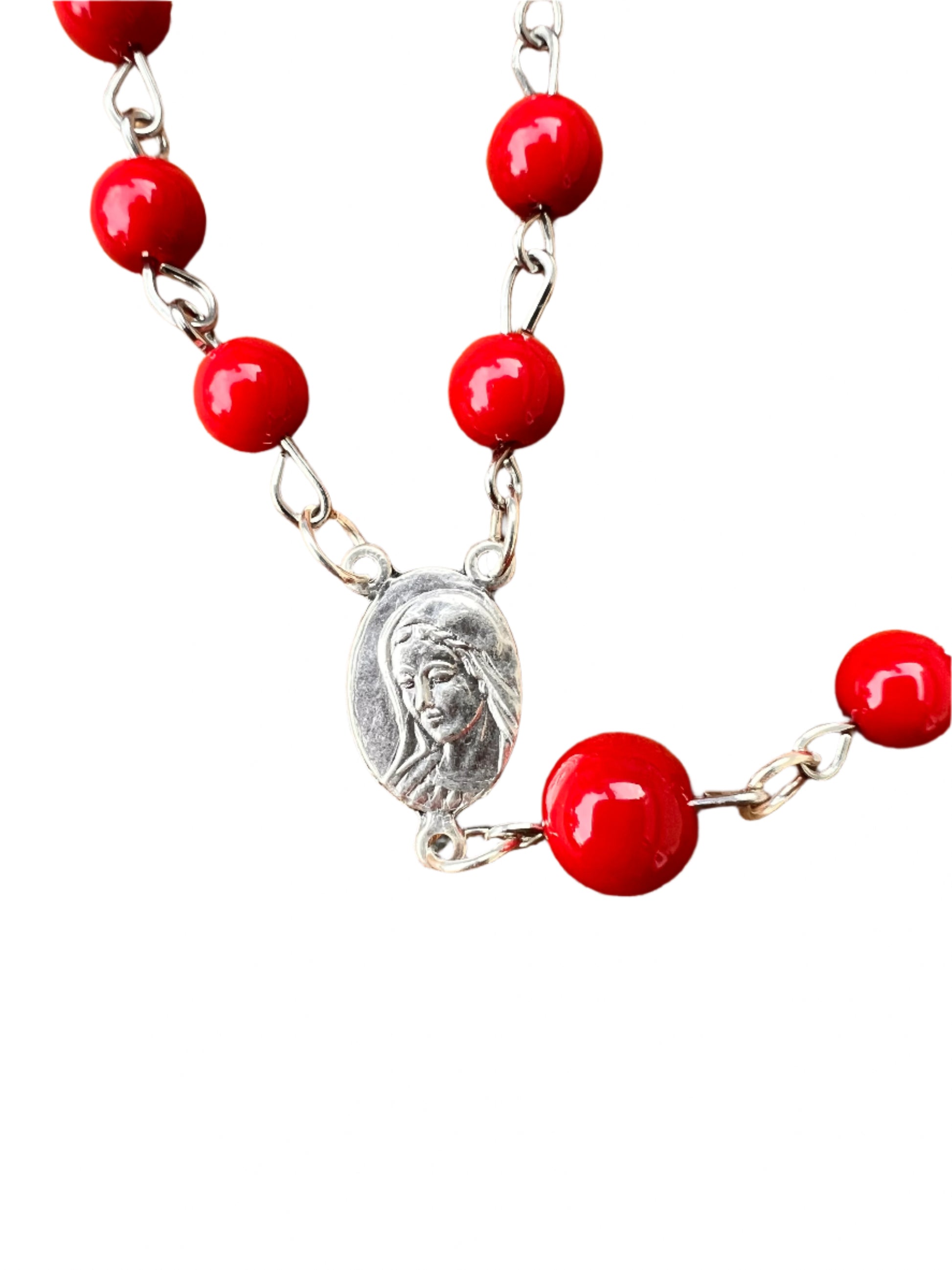 Red beads and a medallion with the face of Jesus