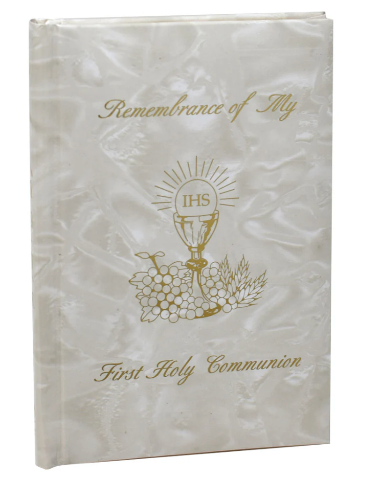 White book with first communion and gold design