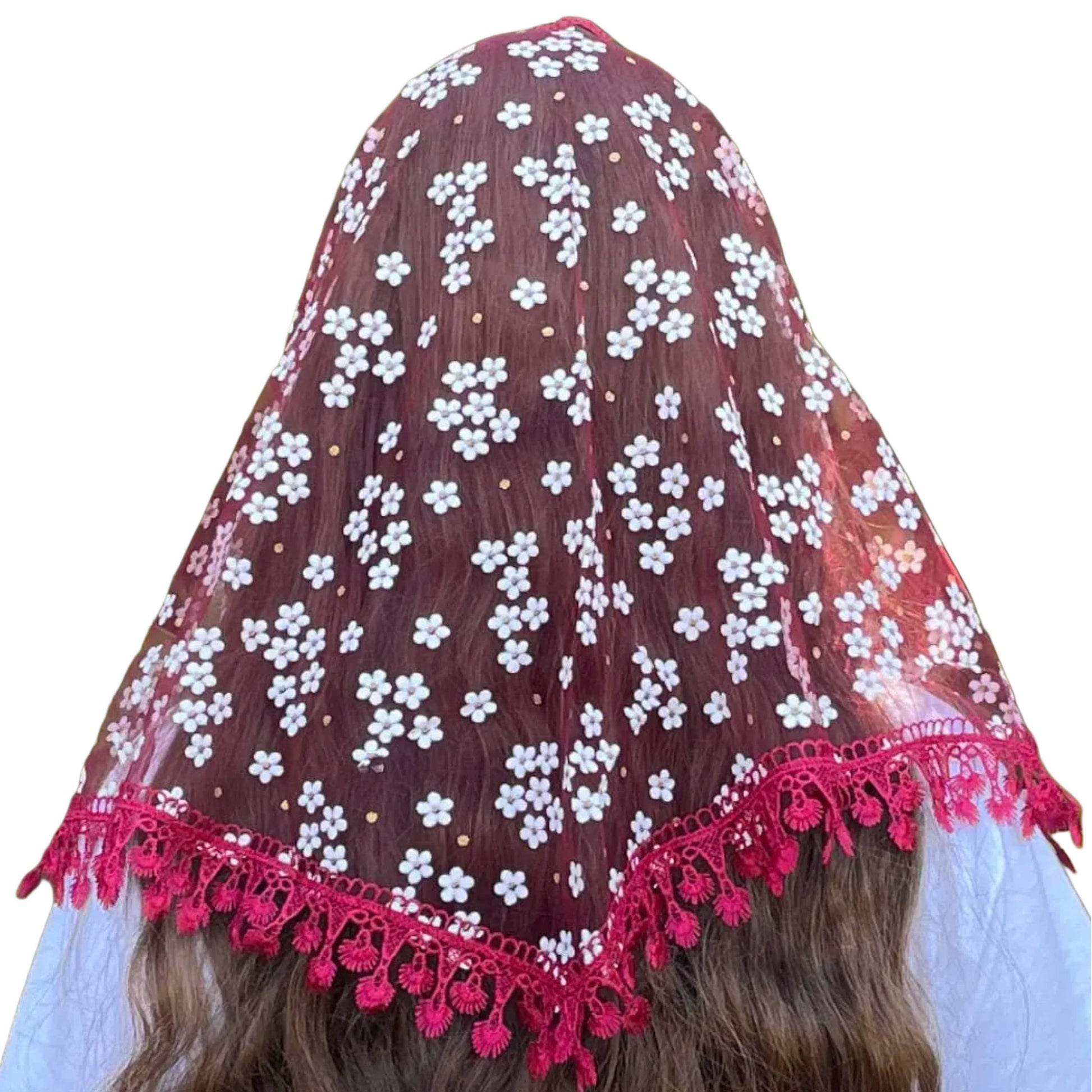 Red floral veil with white flowers and pink tassels on a plain background