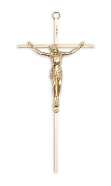 Gold crucifix pendant on a white background