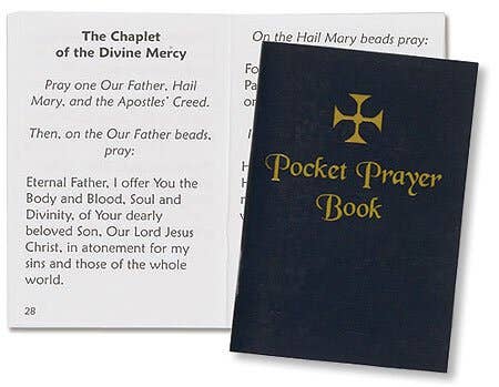 Pocket prayer book with gold cross design on a white background
