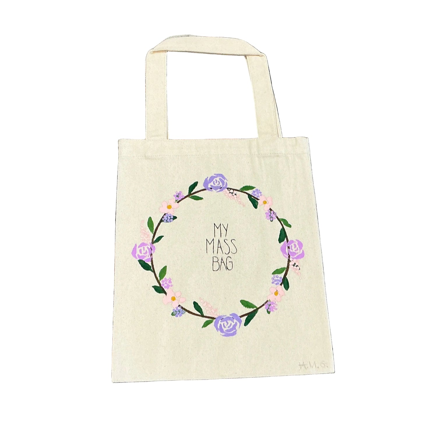 Beige tote bag with floral design and text on a textured floral background