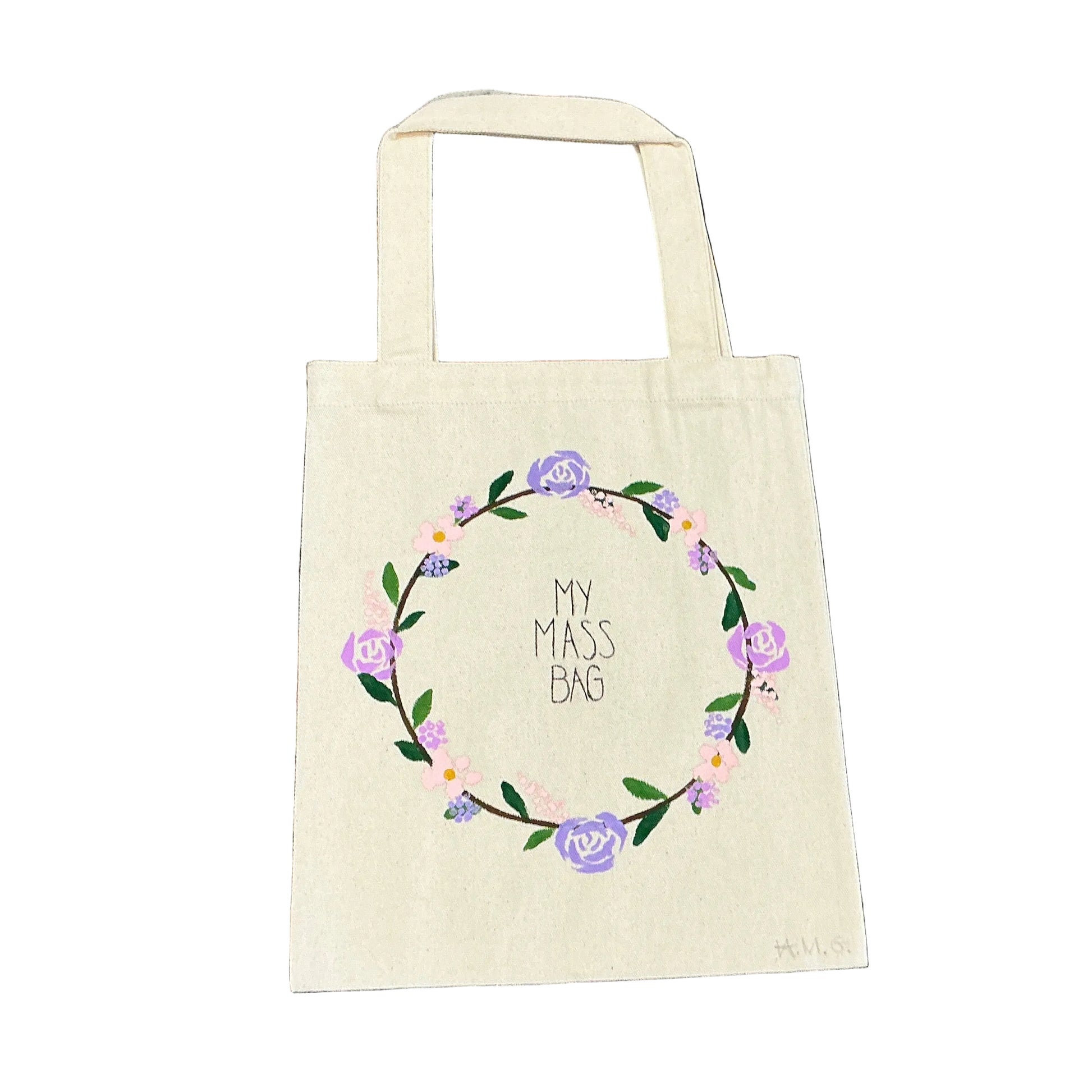Beige tote bag with floral design and text on a textured floral background