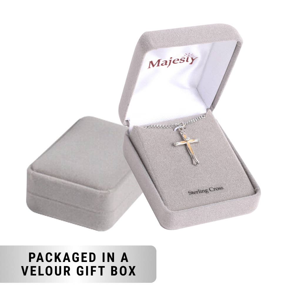 Silver cross necklace in a 'Majesty' branded velour gift box on a white background