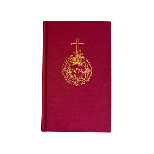 Red book with gold emblem and cross on a white background