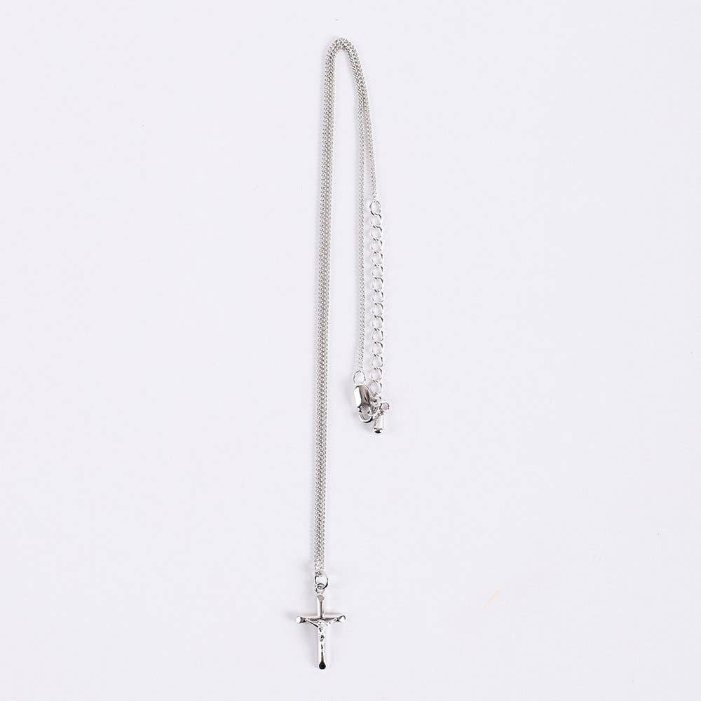Silver necklace with a cross pendant on a white background