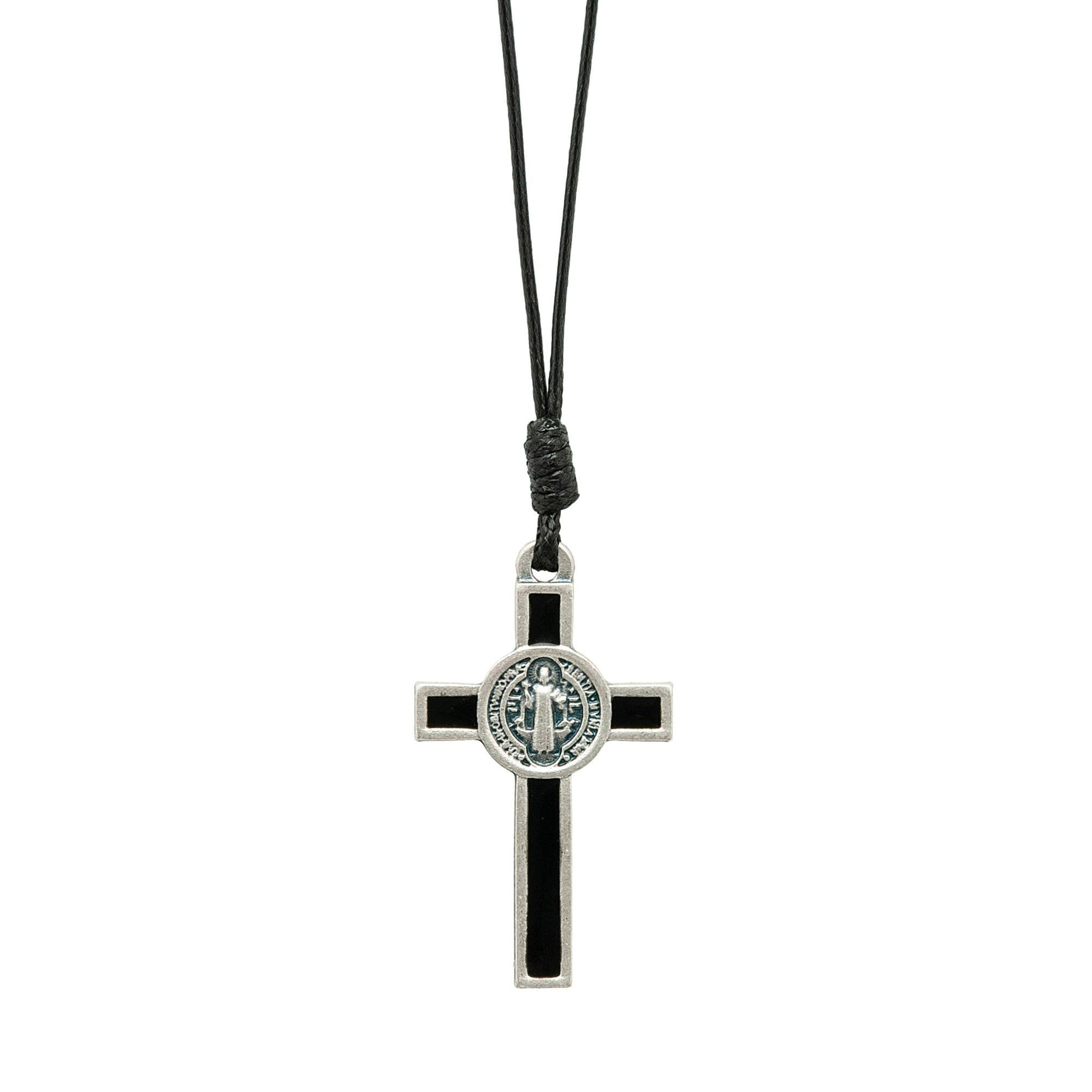 Black and silver cross pendant on a black cord against a white background