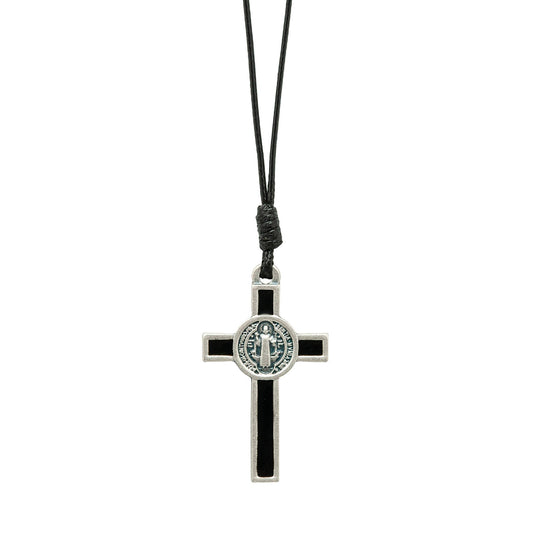 Black and silver cross pendant on a black cord against a white background