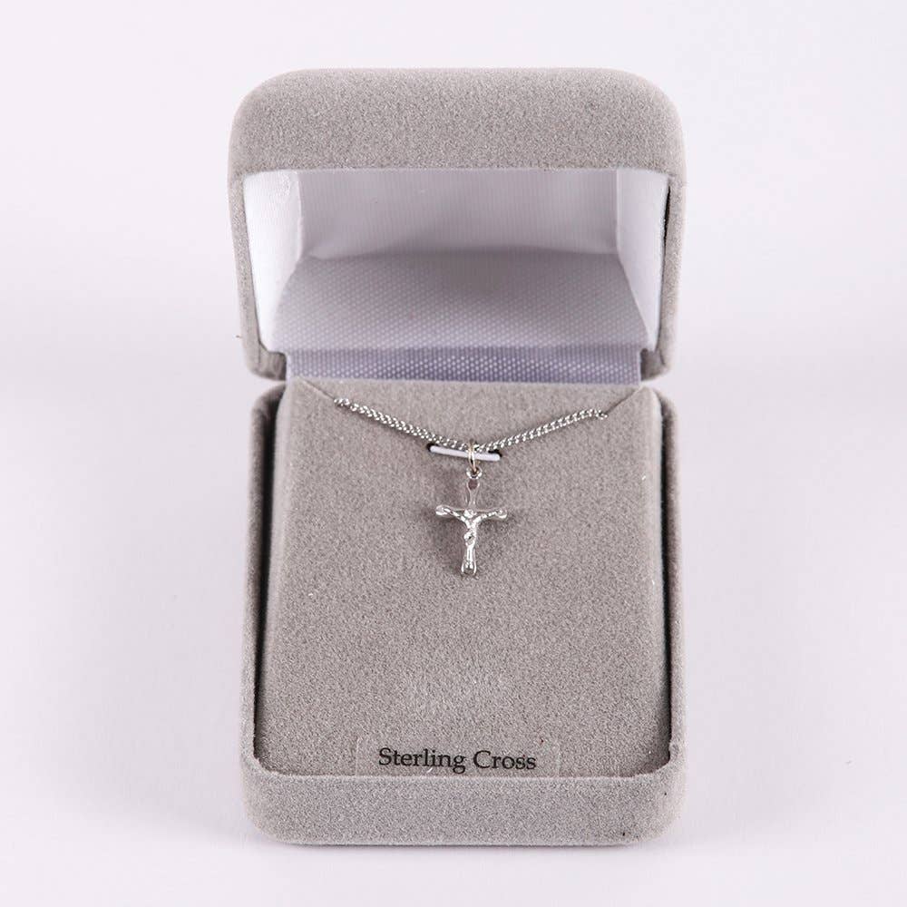 Silver crucifix necklace in a 'Sterling Cross' box on a white background