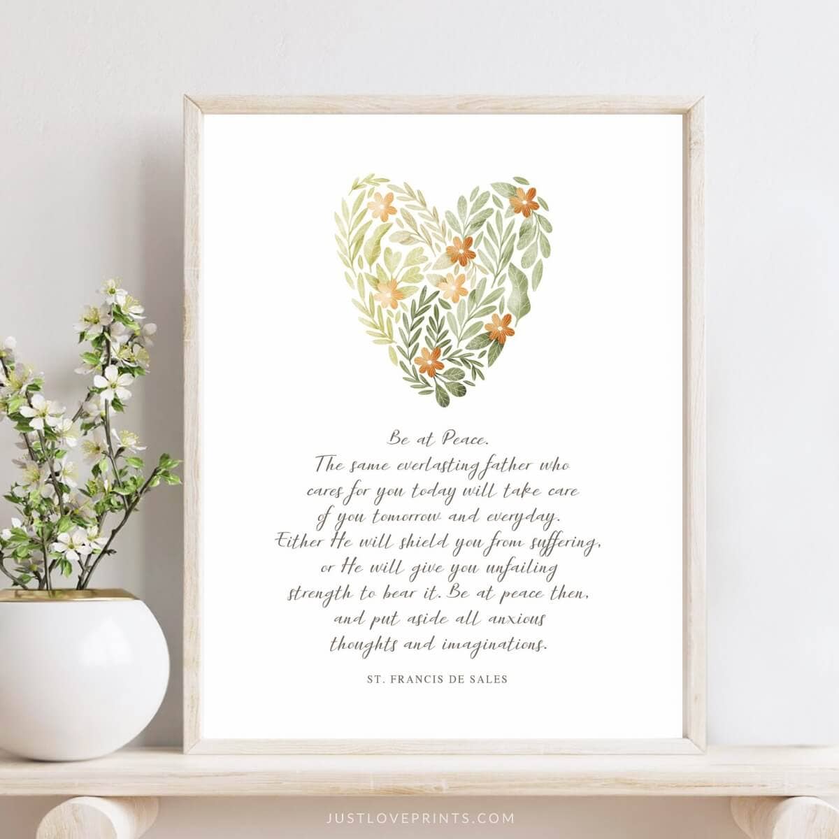 Plant design heart with white background nd text framed with light wood on table with plant