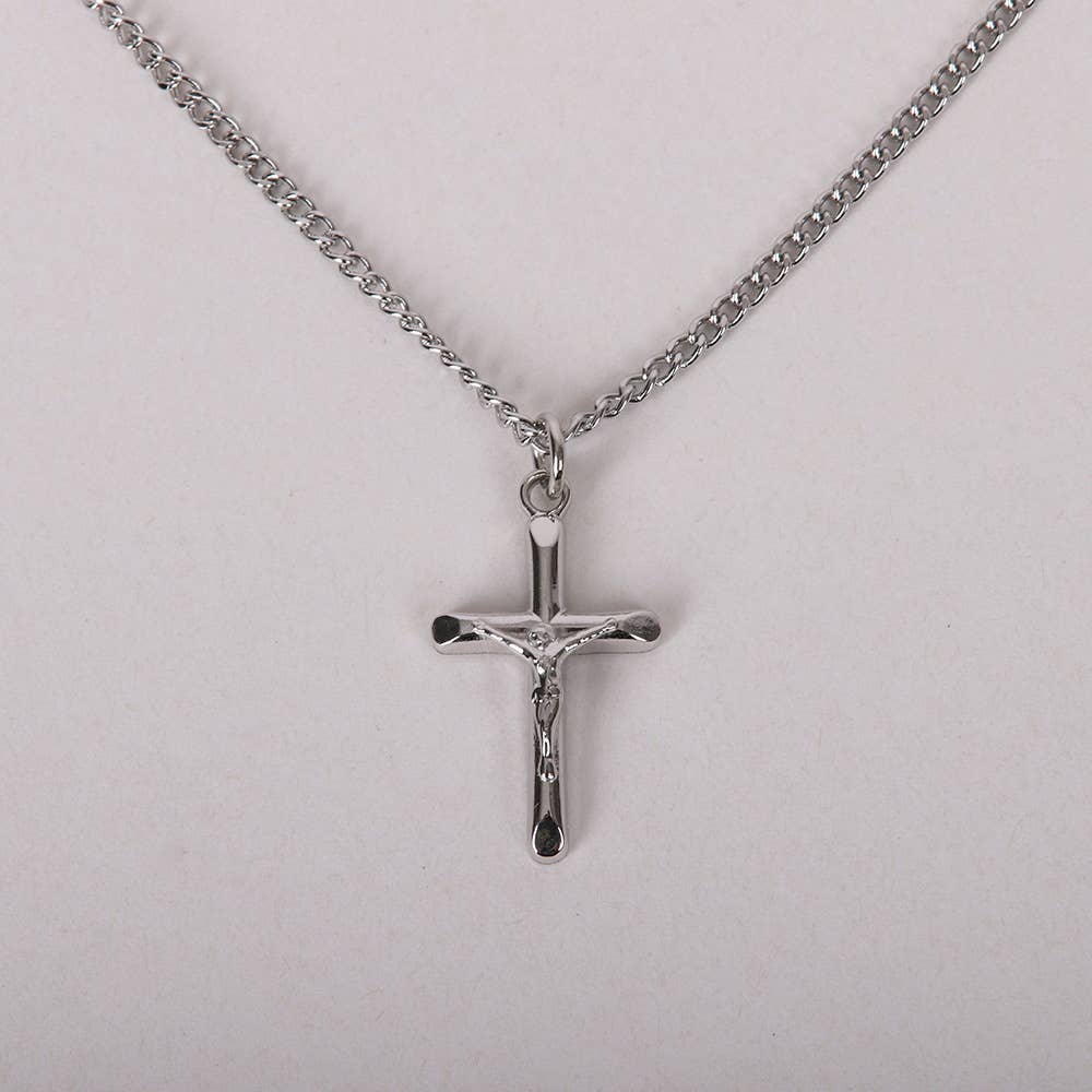 Silver crucifix pendant on a chain against a light gray background
