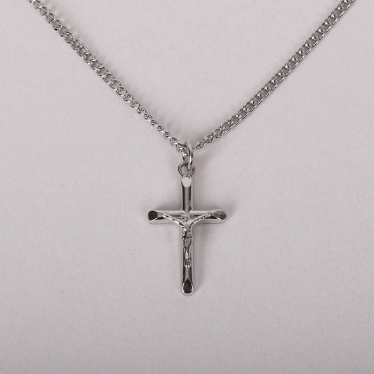 Silver crucifix pendant on a chain against a light gray background
