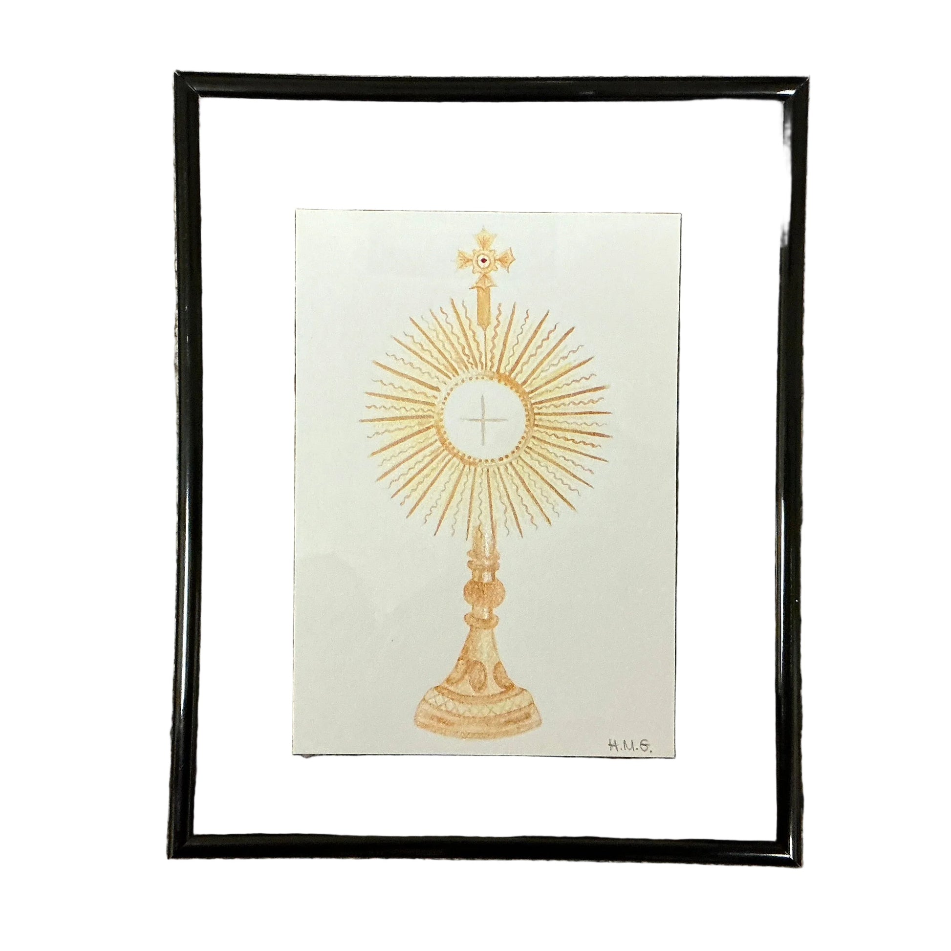 Framed artwork of a gold monstrance on a white background