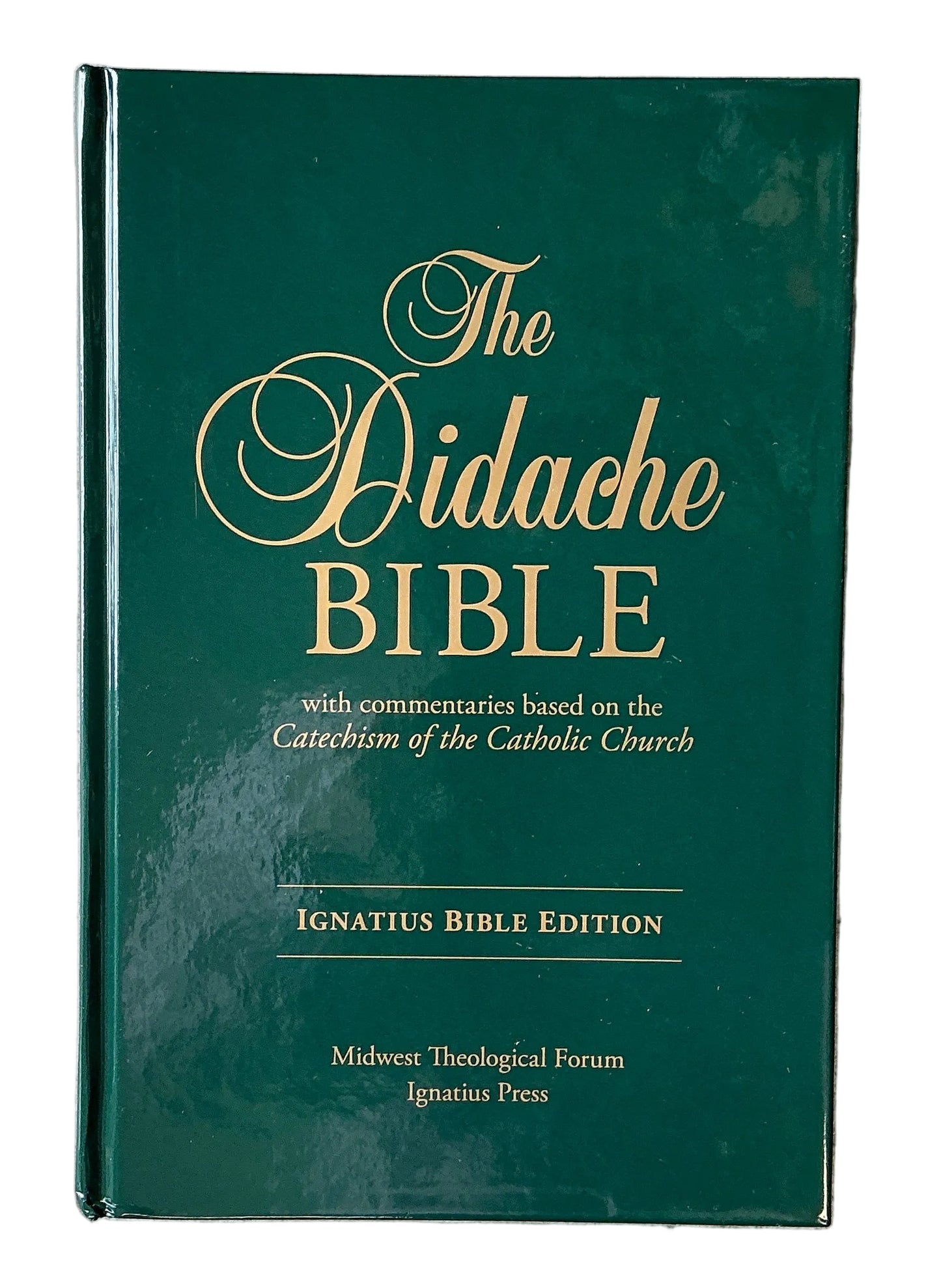 Book titled 'The Didache Bible' on a textured gray surface