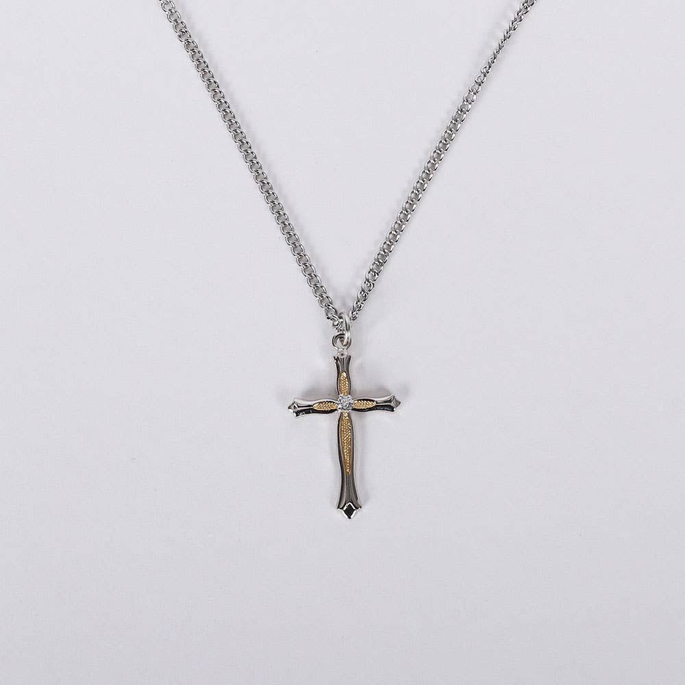 Cross pendant necklace on a light gray background