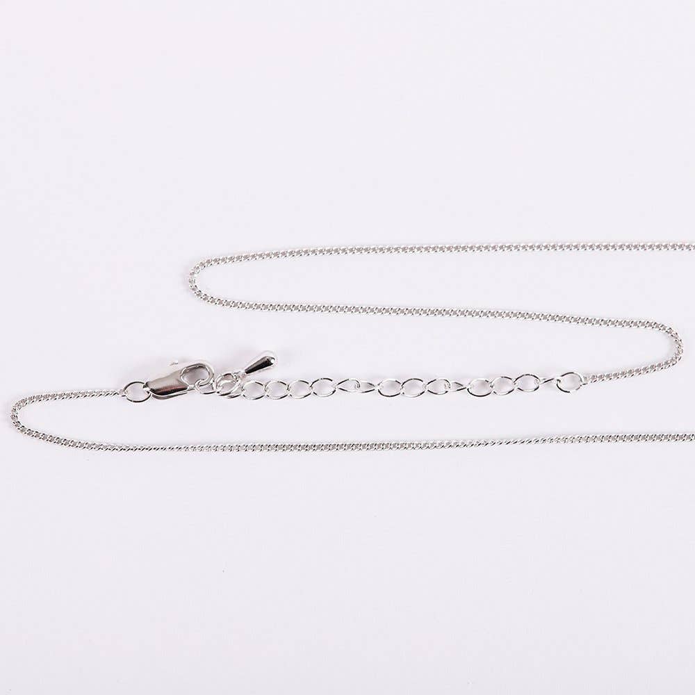 Silver chain necklace on a white background
