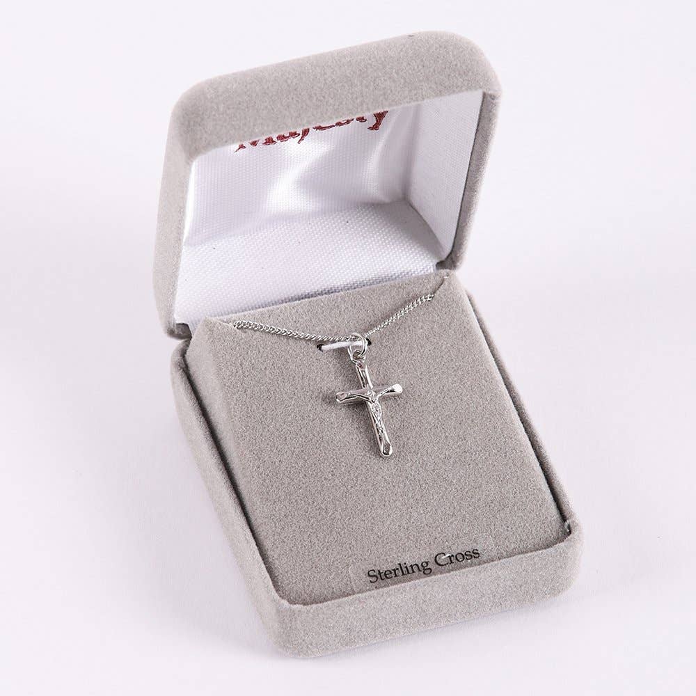 Silver cross necklace in a 'Sterling Cross' box on a white background