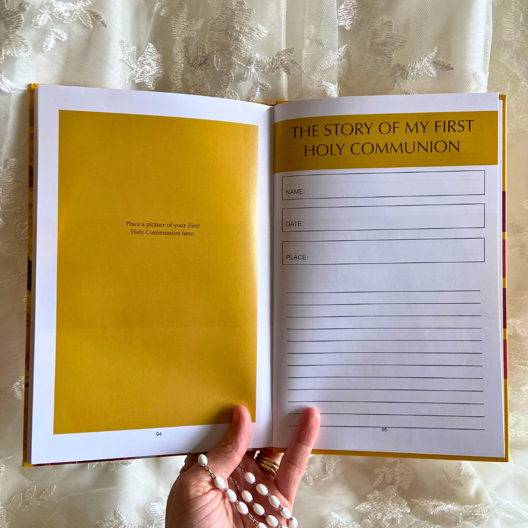 Book open to a page titled 'The Story of My First Holy Communion' held by a hand.