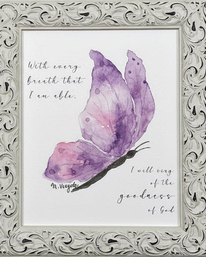 Framed artwork with a purple butterfly illustration and text on a green wall