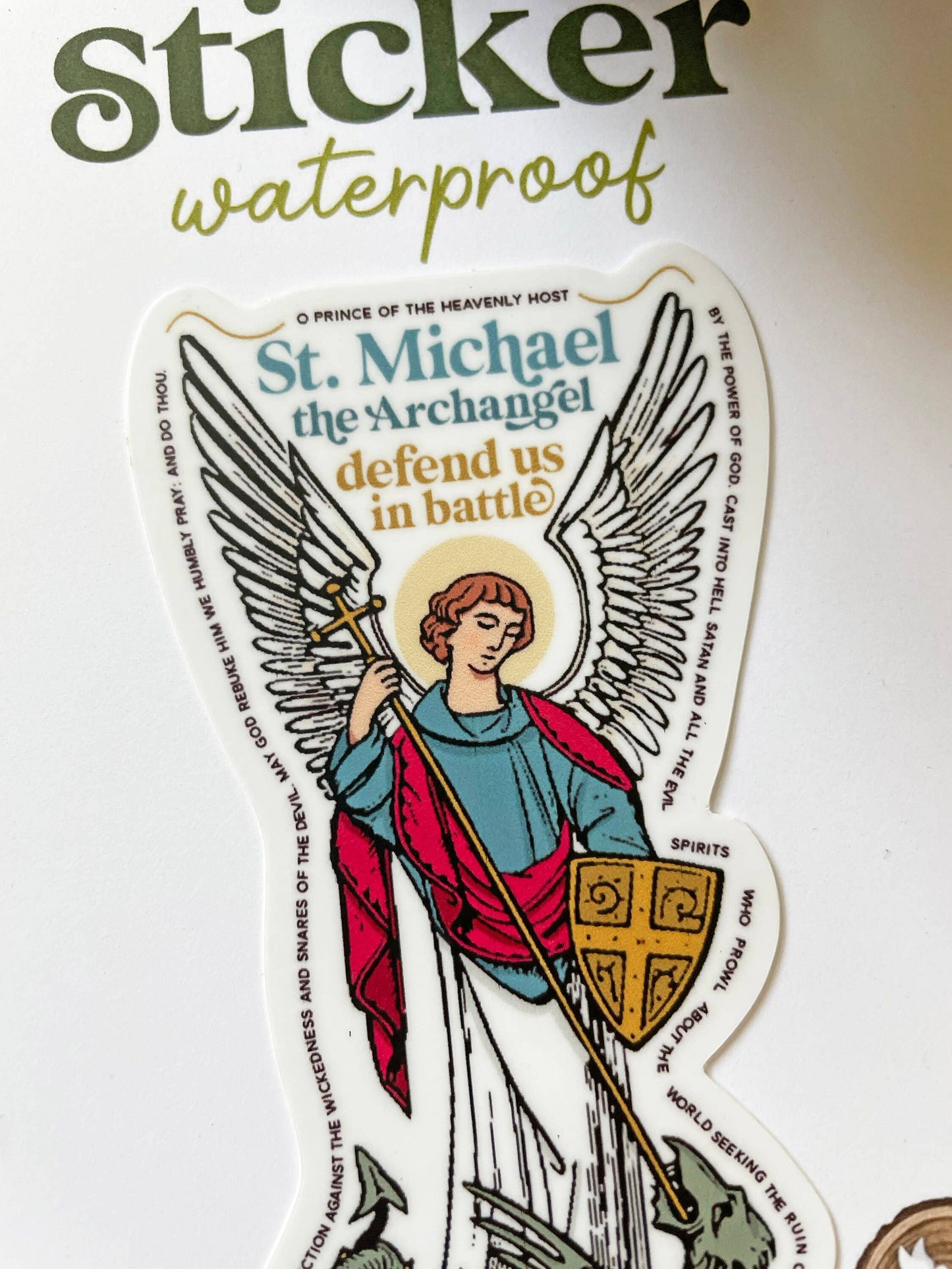 Sticker of St. Michael the Archangel with text on a white background