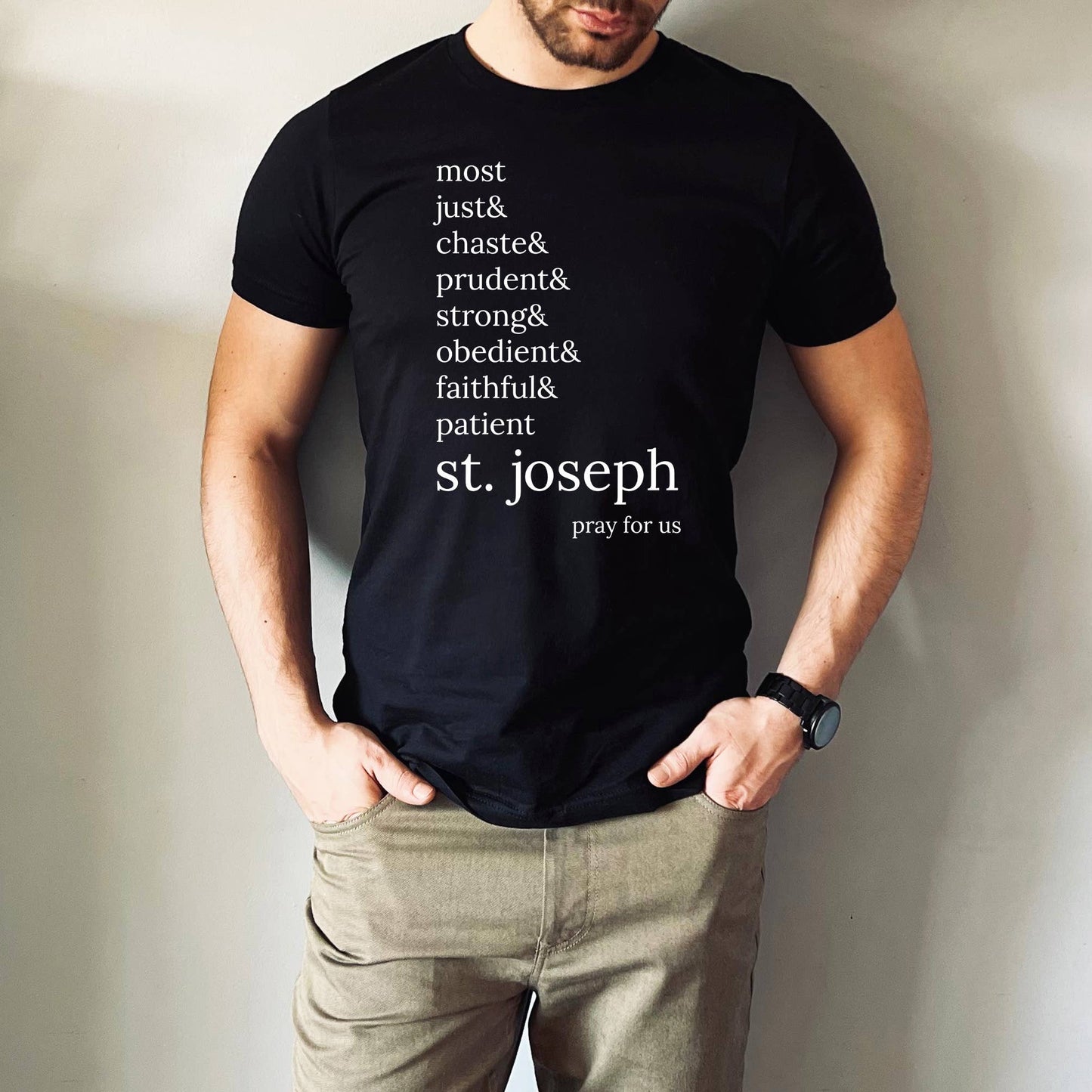 Man wearing shirt that says, “most just & chaste & prudent & strong & obedient & faithful & patient- st. Joseph pray for us”