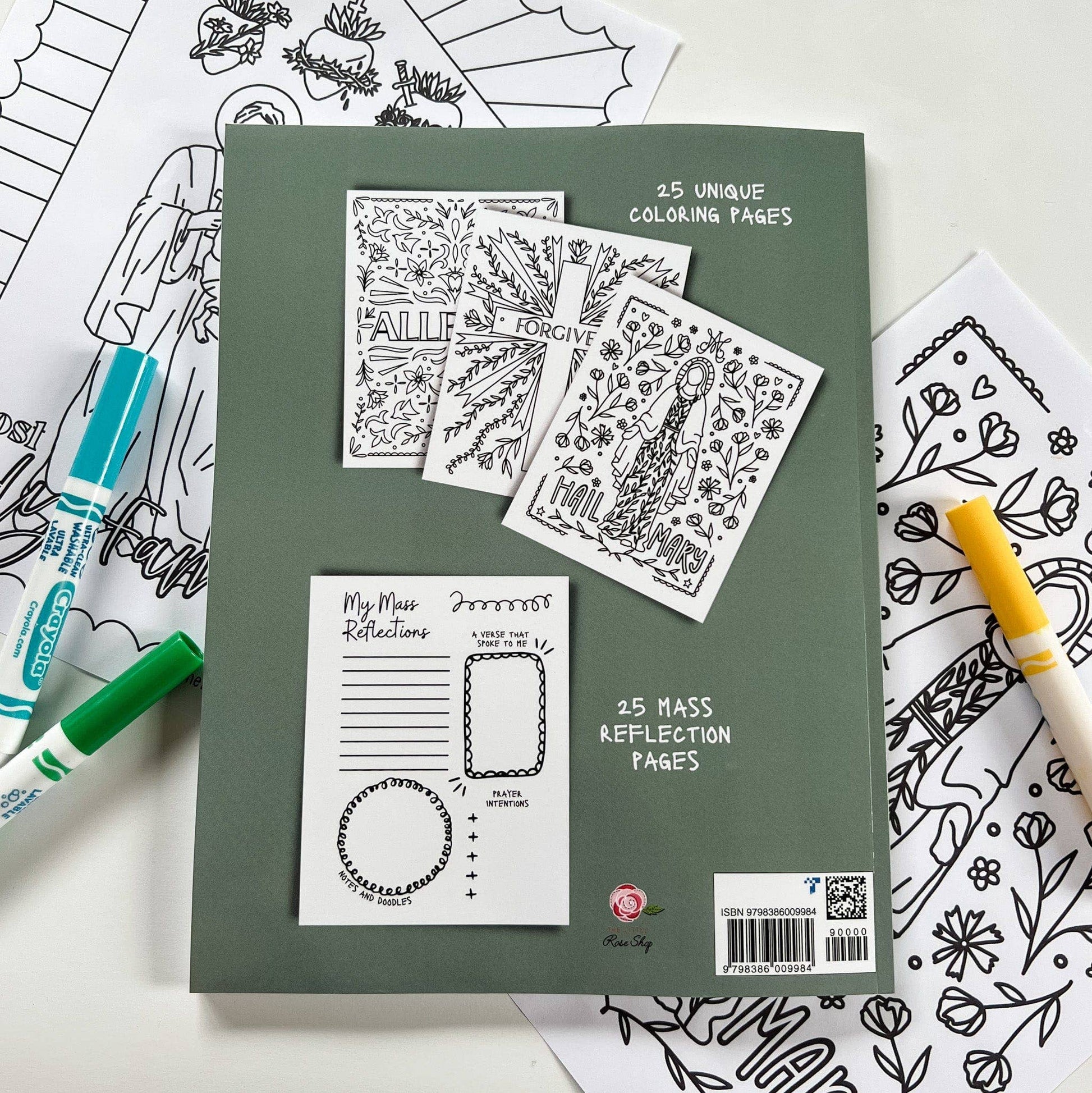 Green coloring book with coloring pages and markers on a white background