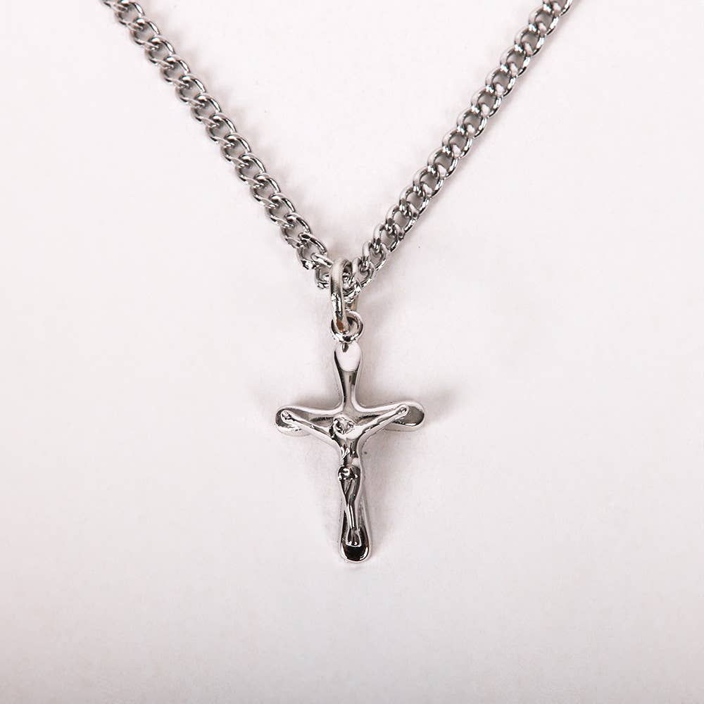 Silver crucifix necklace on a white background