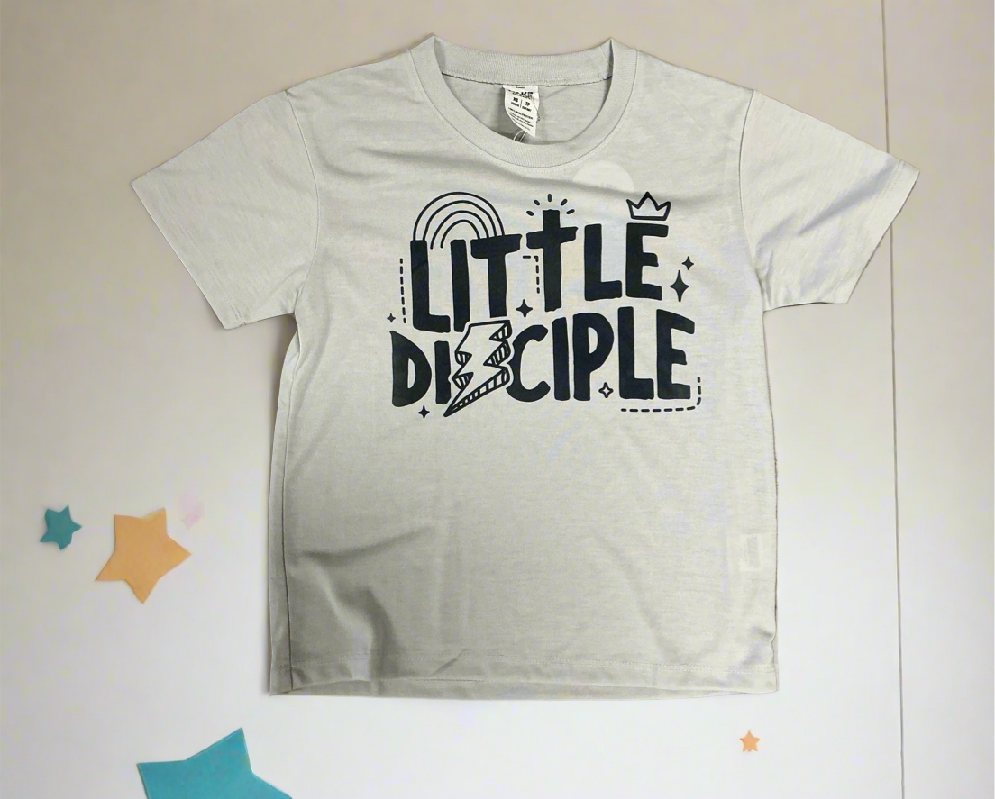 White t-shirt with 'Little Disciple' text on a light background