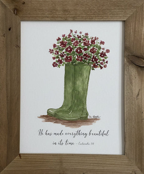 Framed artwork of a green boot with flowers on a beige wall